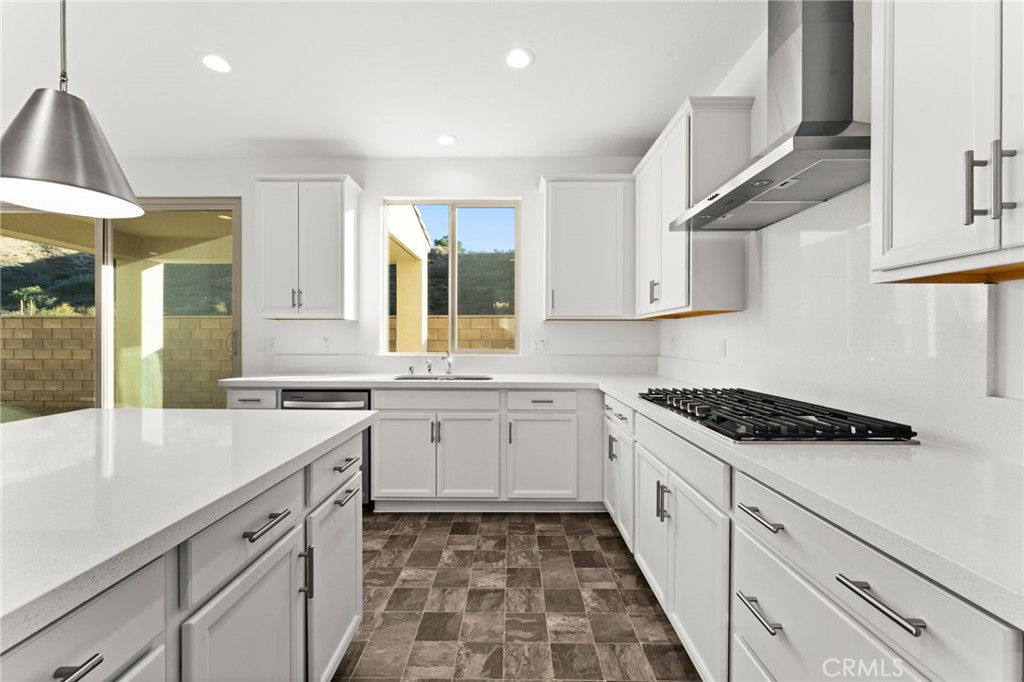 8465 Anthony Street Colton, CA 92324 - Photo 2 of 43 a kitchen with granite countertop white cabinets and white appliances