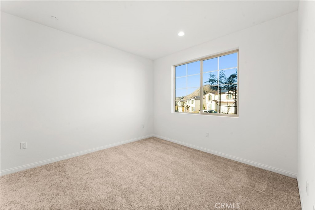 8465 Anthony Street Colton, CA 92324 - Photo 22 of 43 an empty room with windows and wall painting