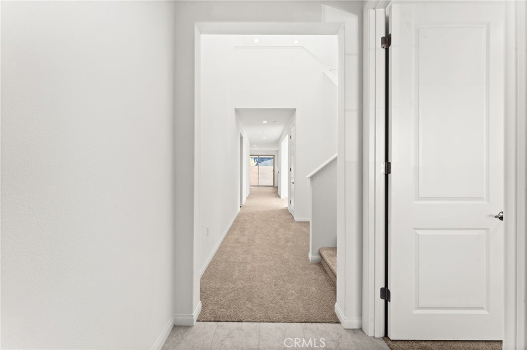 8465 Anthony Street Colton, CA 92324 - Photo 24 of 43 a view of a hallway with wooden floor