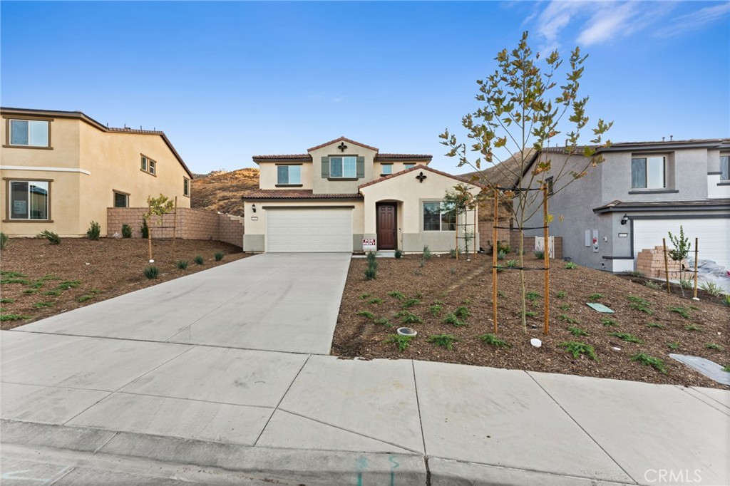 8465 Anthony Street Colton, CA 92324 - Photo 25 of 43 a view of a white house next to a yard