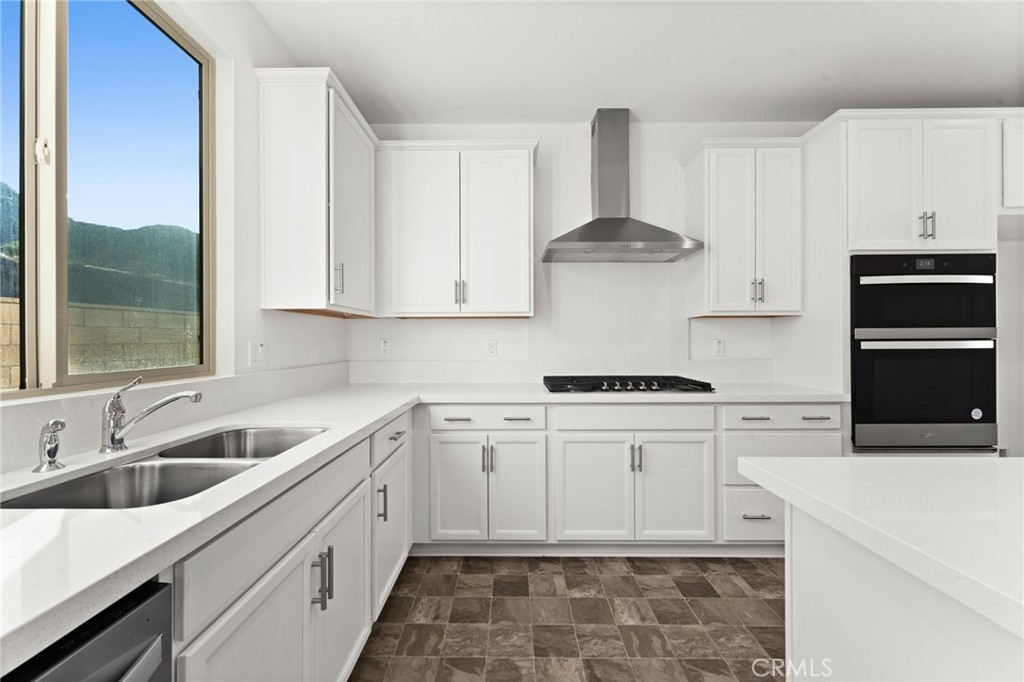 8465 Anthony Street Colton, CA 92324 - Photo 3 of 43 a kitchen with stainless steel appliances granite countertop a sink stove and refrigerator