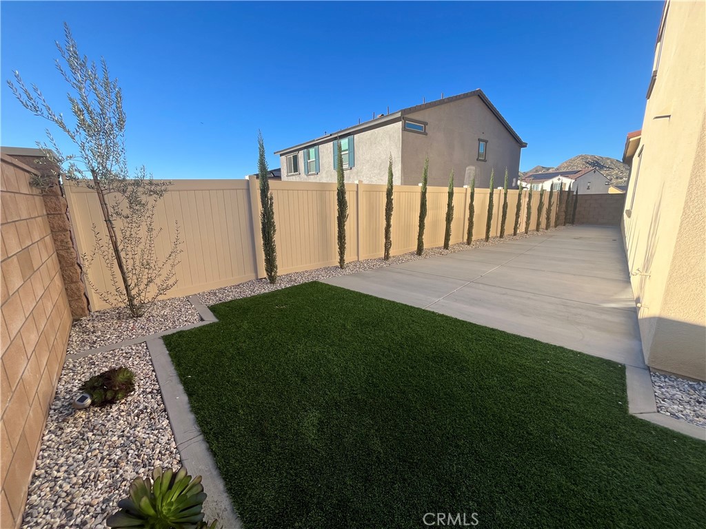 8465 Anthony Street Colton, CA 92324 - Photo 40 of 43 a front view of a house with garden