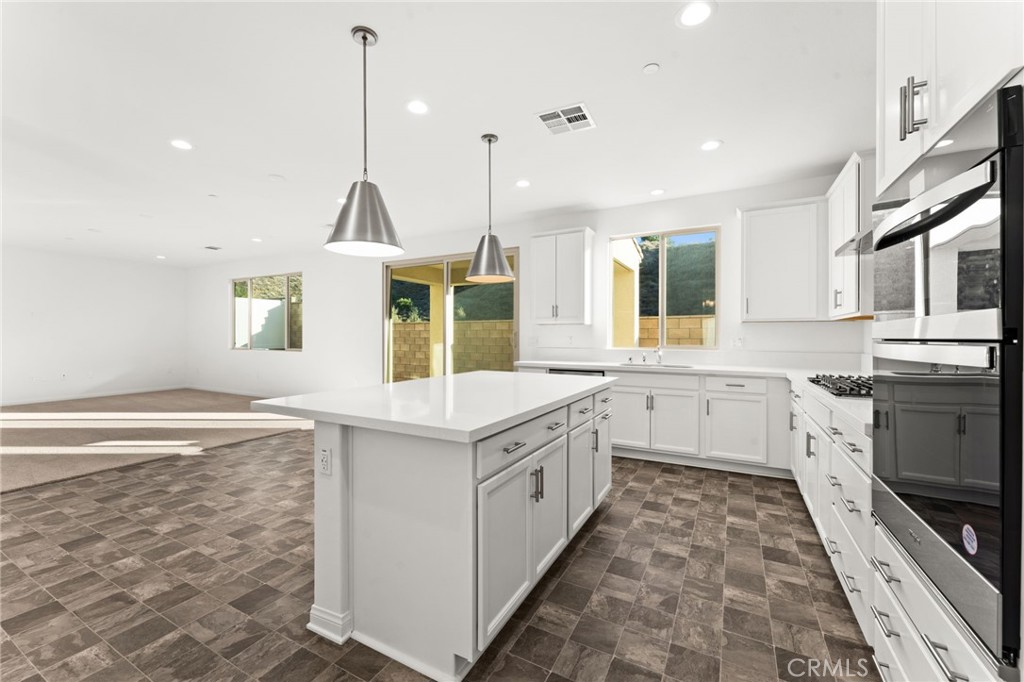 8465 Anthony Street Colton, CA 92324 - Photo 5 of 43 a kitchen with a sink stove and microwave