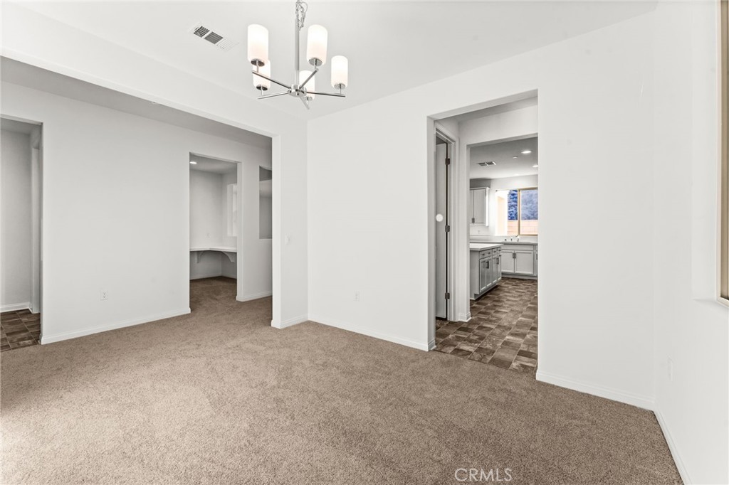 8465 Anthony Street Colton, CA 92324 - Photo 7 of 43 a view of a room with a stylish ceiling fan and entryway