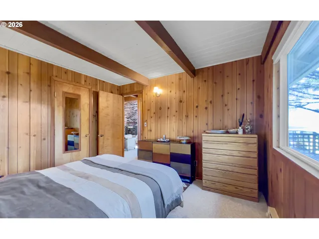 a bed room with a bed and a window