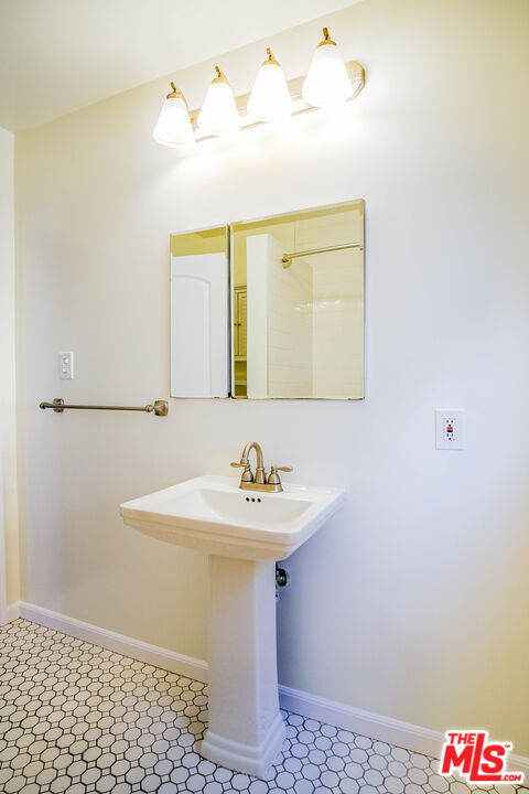 3564 Dover Street Los Angeles, CA 90039 - Photo 12 of 22 a bathroom with a sink and a mirror
