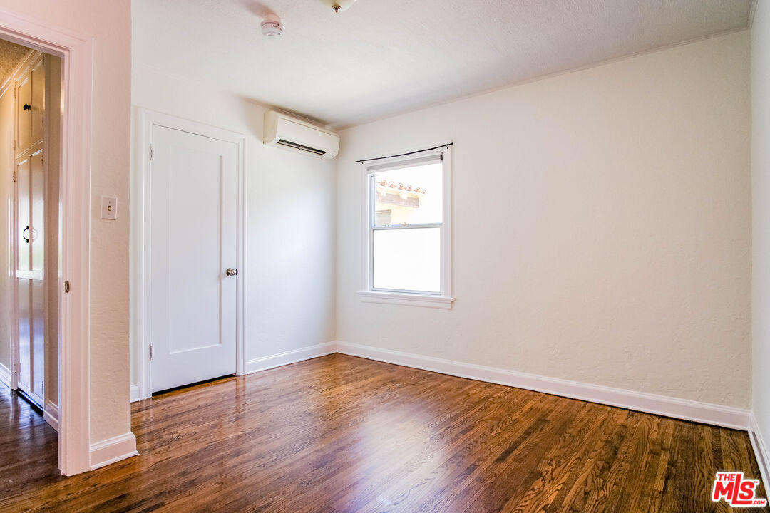 3564 Dover Street Los Angeles, CA 90039 - Photo 13 of 22 a view of an empty room with wooden floor and a window