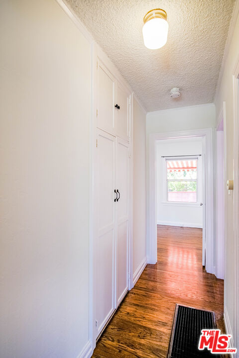 3564 Dover Street Los Angeles, CA 90039 - Photo 10 of 22 a view of a hallway with wooden floor and closet
