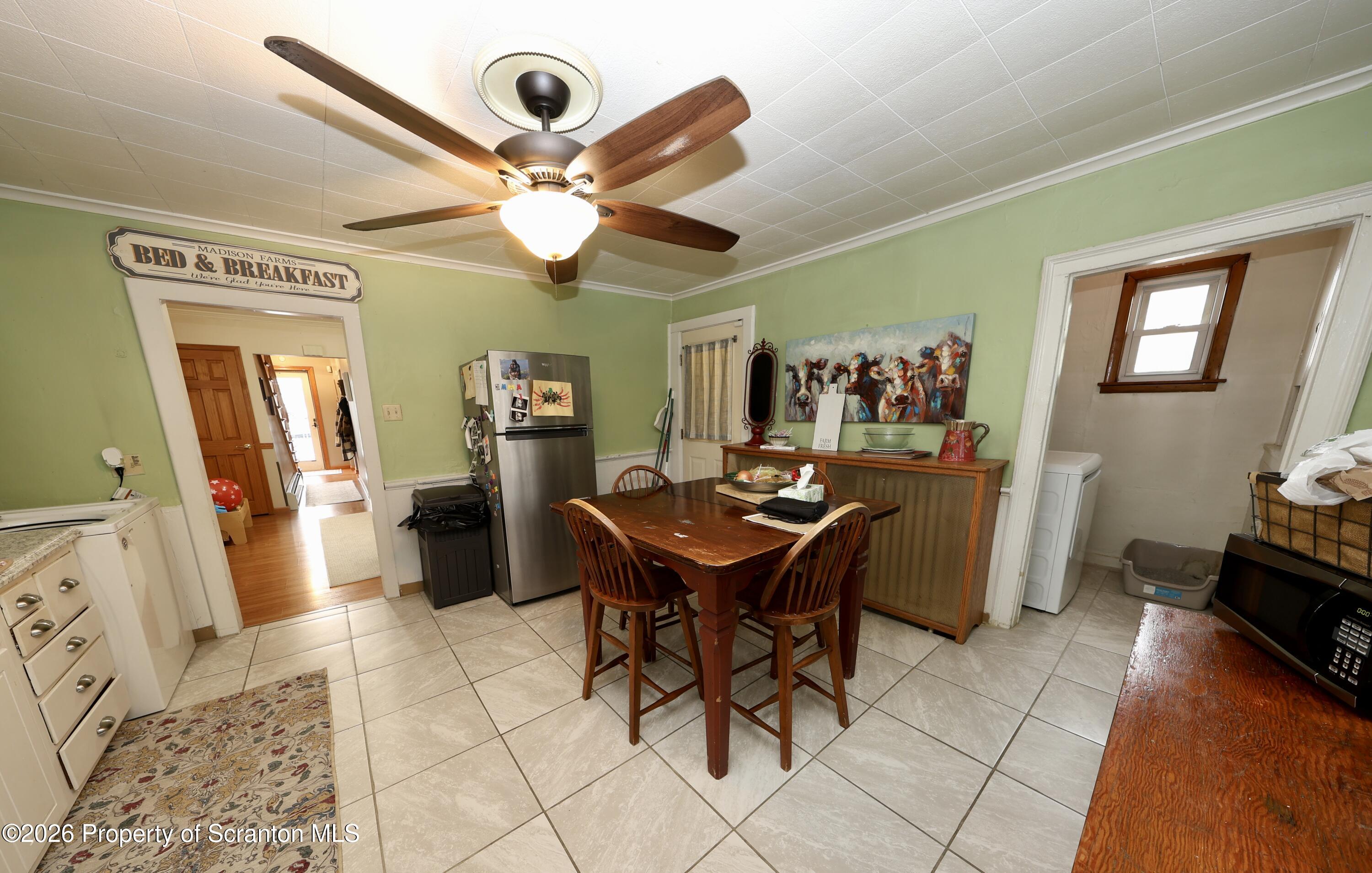 1338 Lafayette Street Scranton, PA 18504 - Photo 13 of 31 a view of a dining room with furniture and a chandelier