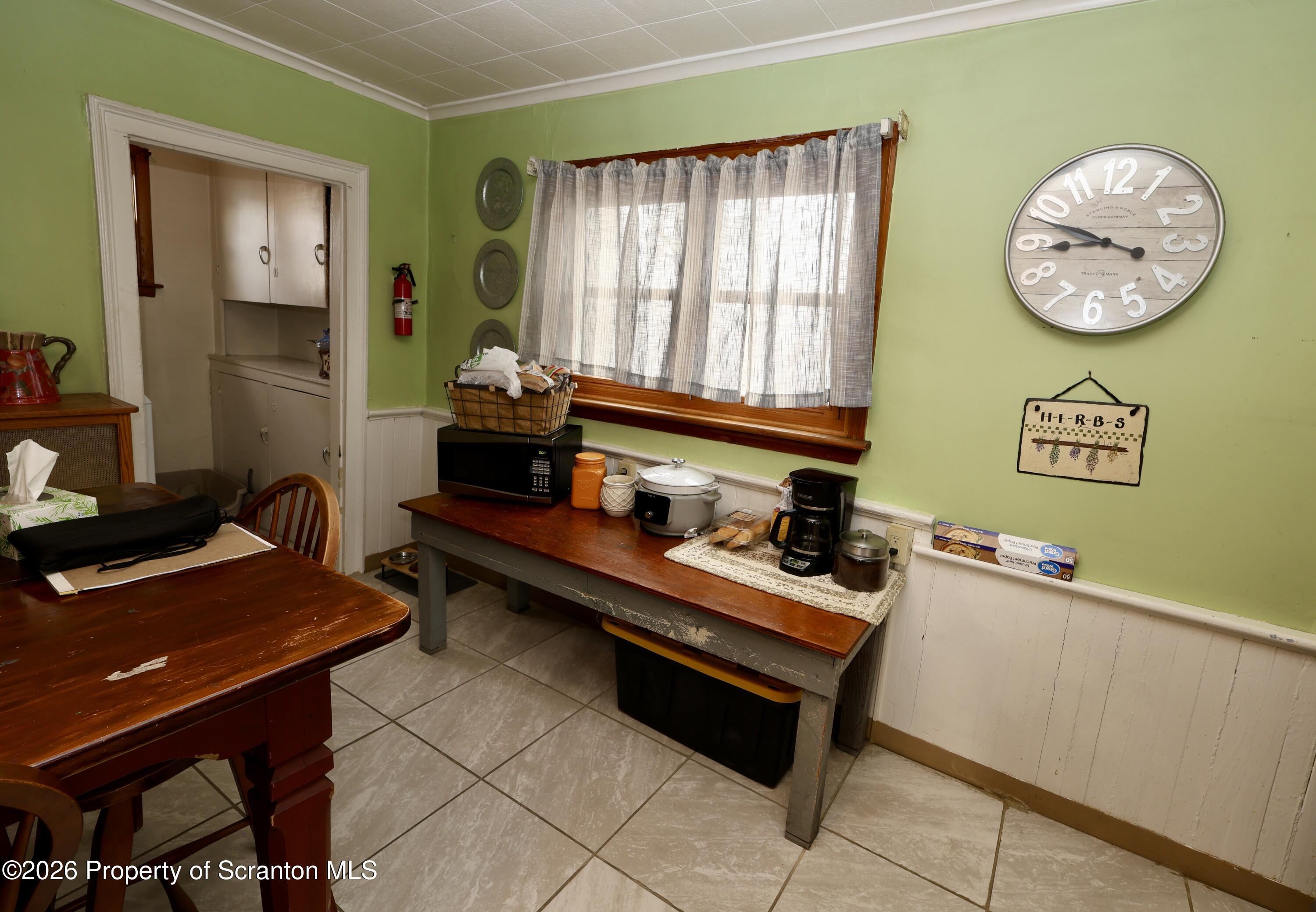 1338 Lafayette Street Scranton, PA 18504 - Photo 16 of 31 a room with furniture and paintings on the wall
