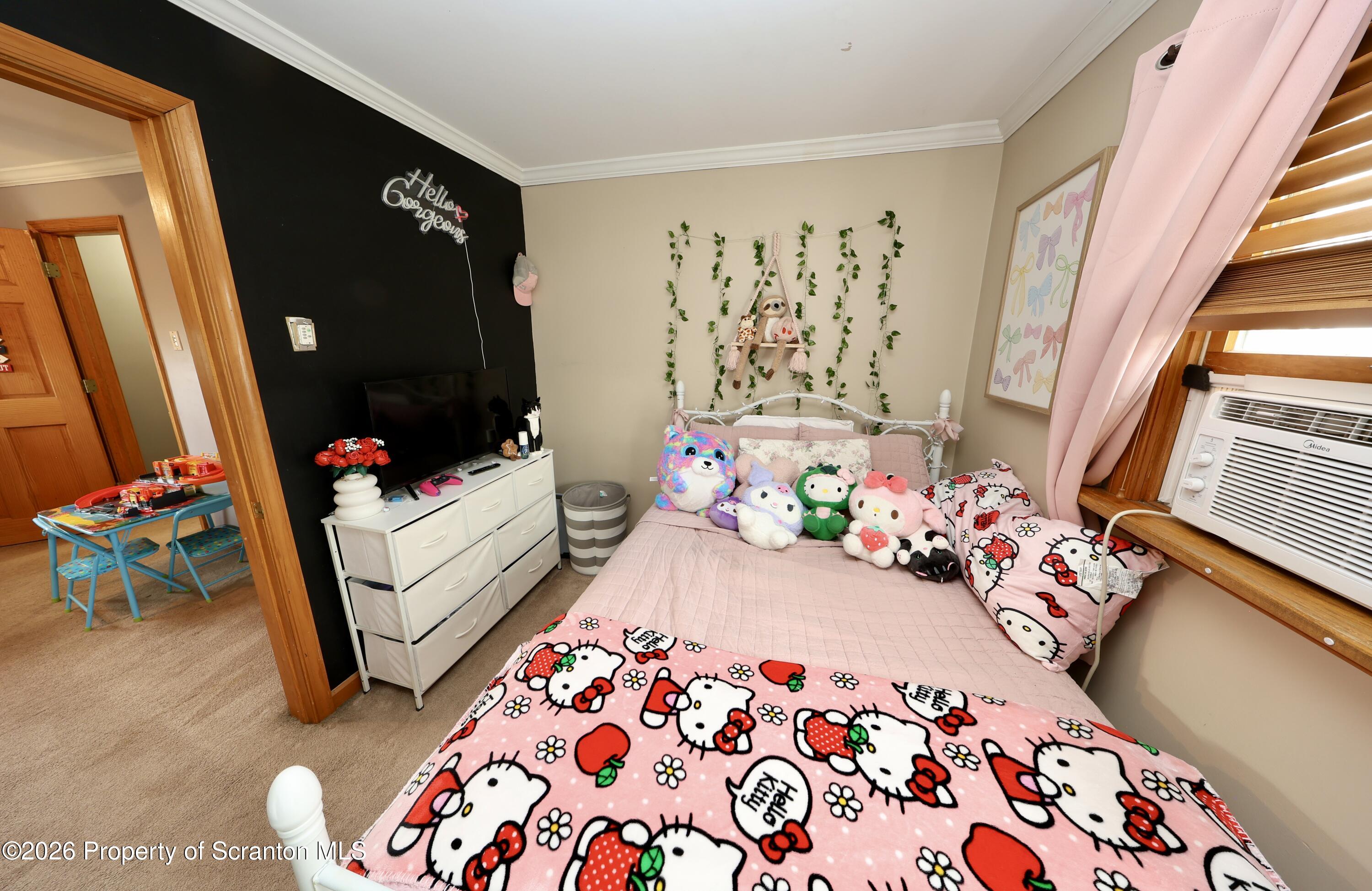 1338 Lafayette Street Scranton, PA 18504 - Photo 20 of 31 a bedroom with baby bed and a window