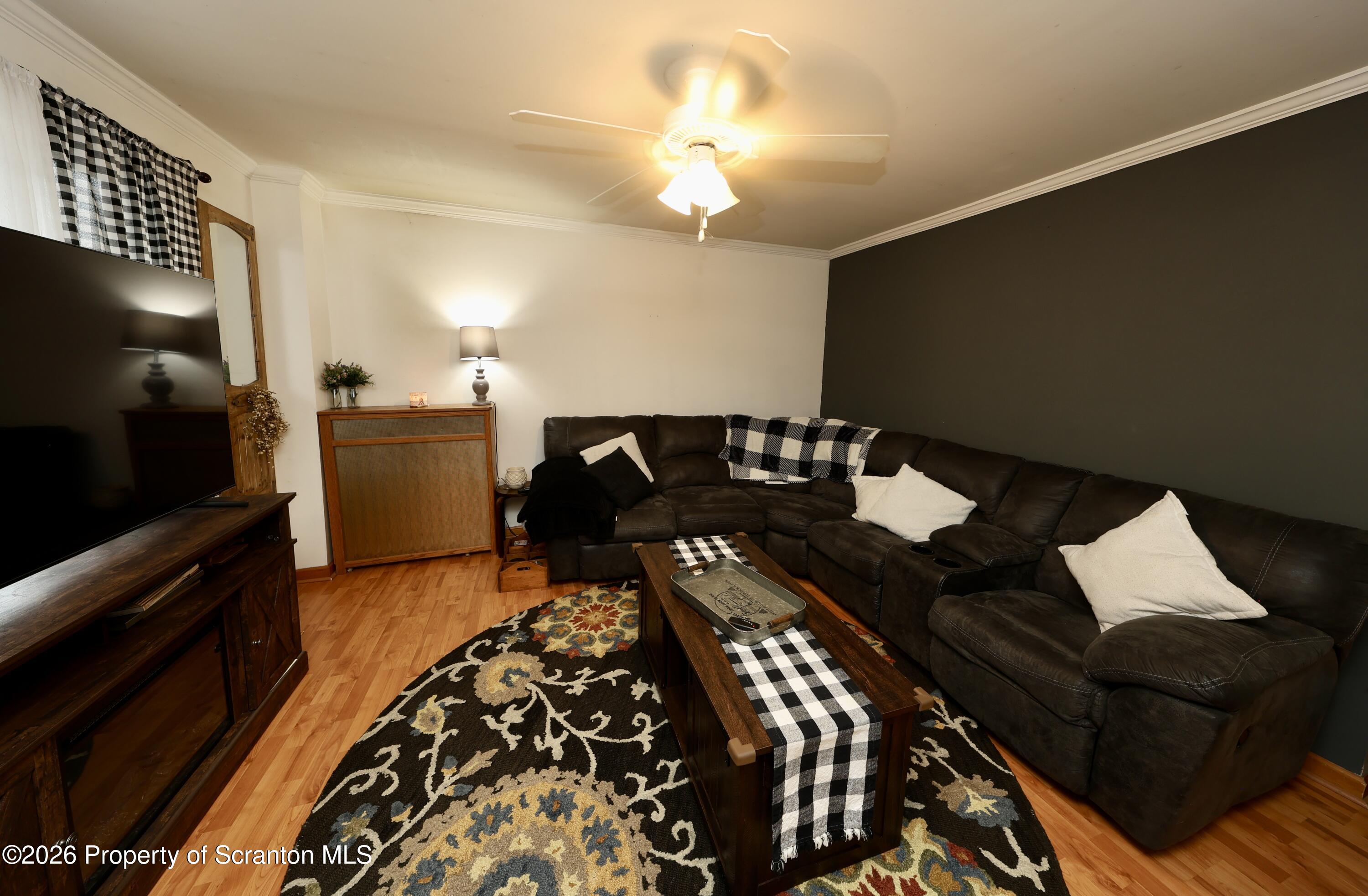 1338 Lafayette Street Scranton, PA 18504 - Photo 2 of 31 a living room with furniture and a flat screen tv