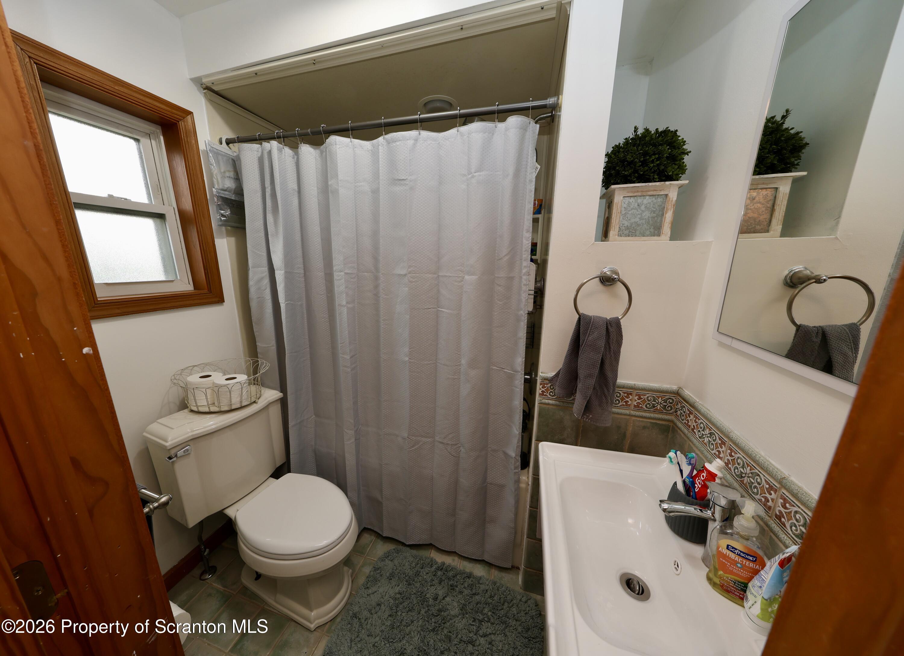 1338 Lafayette Street Scranton, PA 18504 - Photo 24 of 31 a bathroom with a toilet and a sink