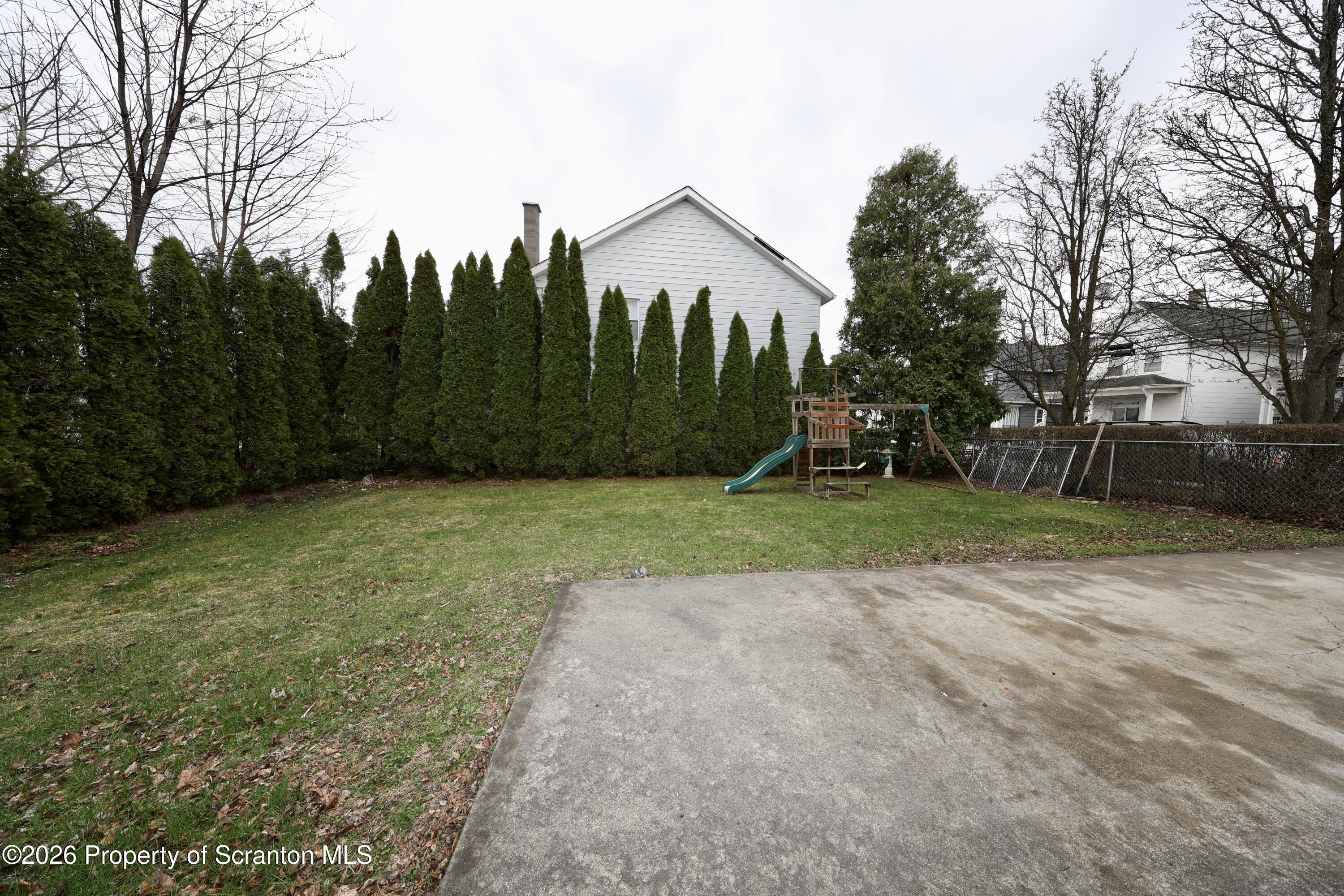 1338 Lafayette Street Scranton, PA 18504 - Photo 27 of 31 a view of a yard with a house in the background