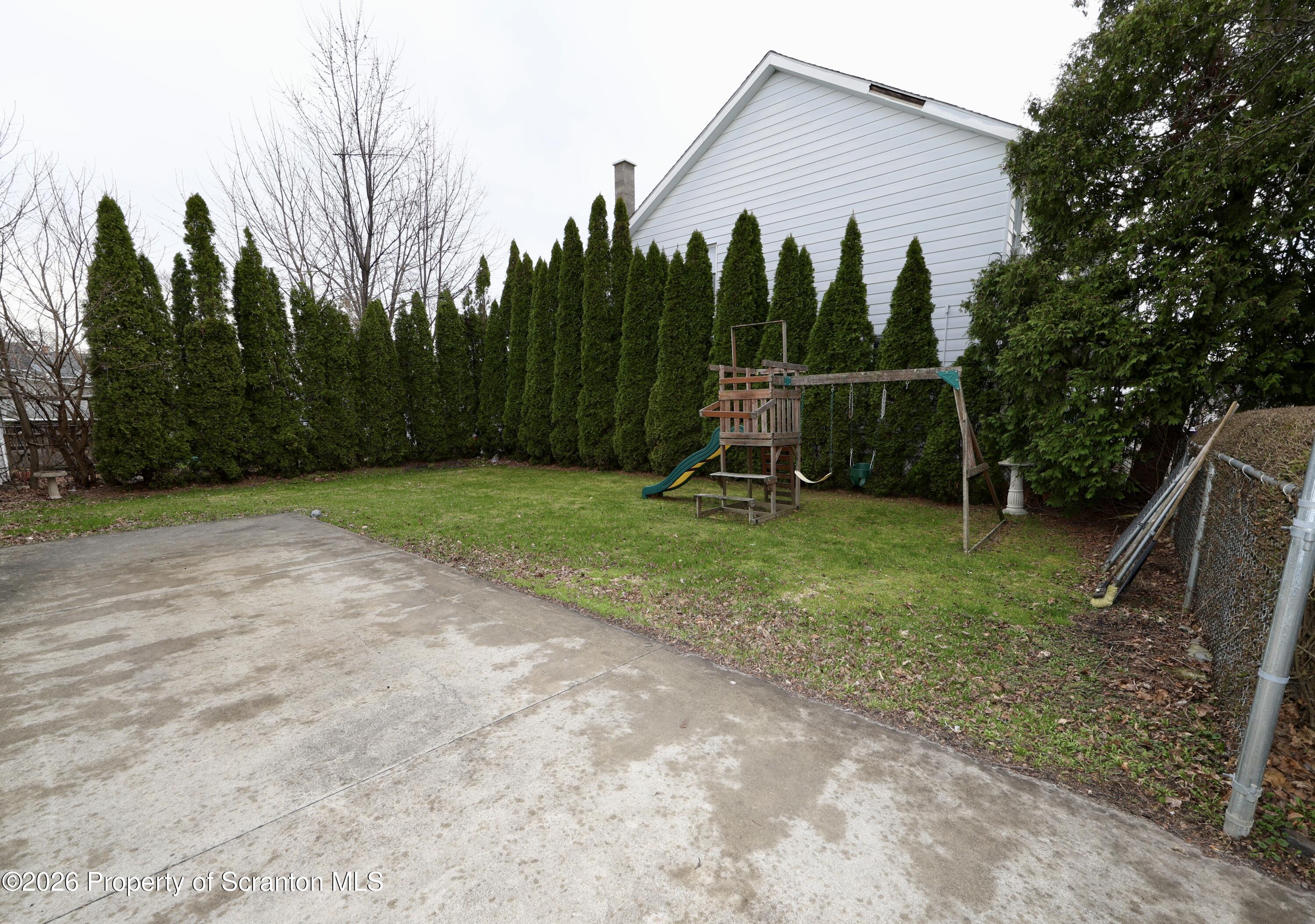 1338 Lafayette Street Scranton, PA 18504 - Photo 28 of 31 a view of a house with backyard and a slide