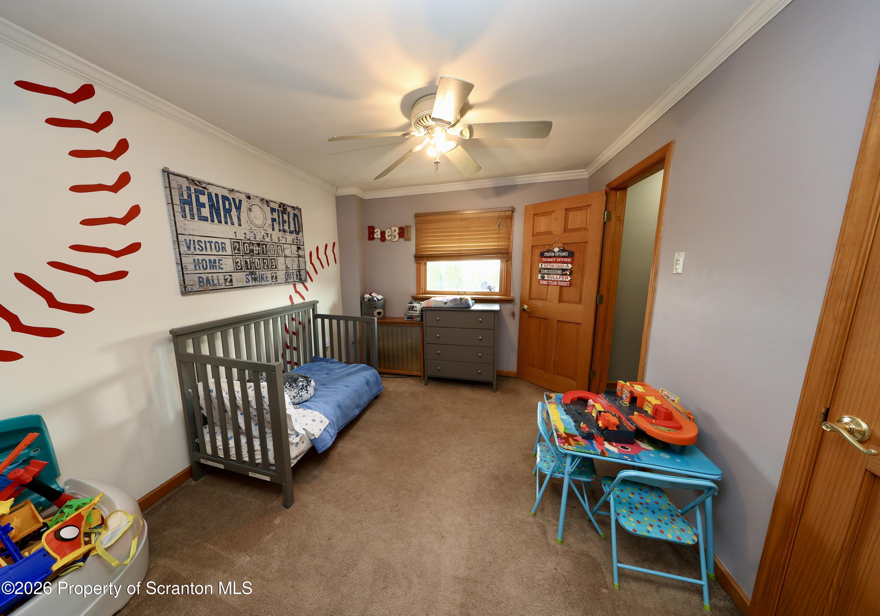1338 Lafayette Street Scranton, PA 18504 - Photo 6 of 31 a bedroom with furniture and a baby crib