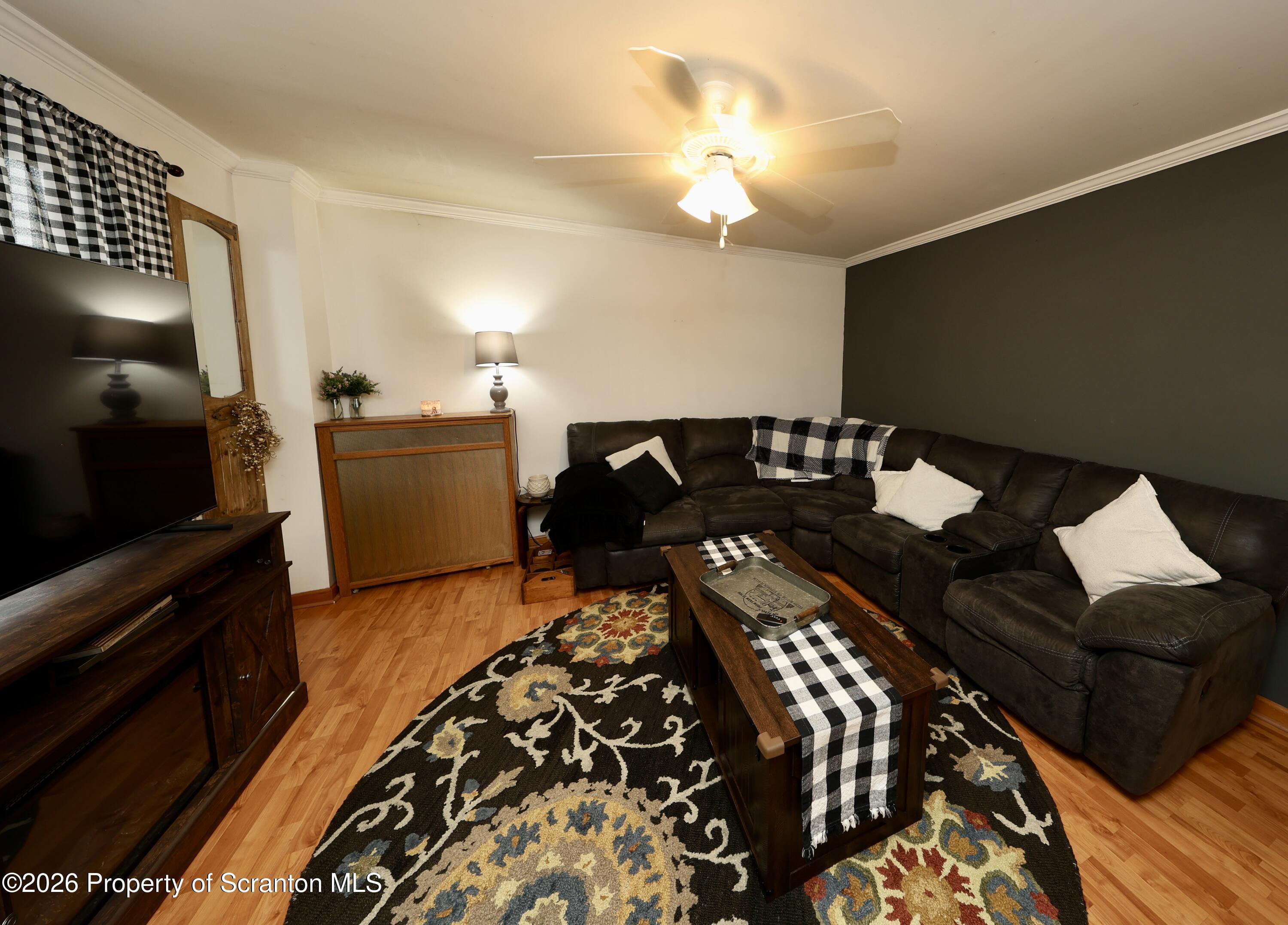 1338 Lafayette Street Scranton, PA 18504 - Photo 8 of 31 a living room with furniture and a flat screen tv