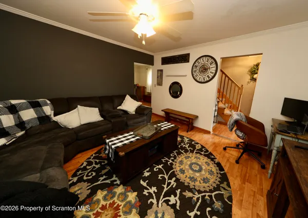a bedroom with a bed and a lamp on the dresser
