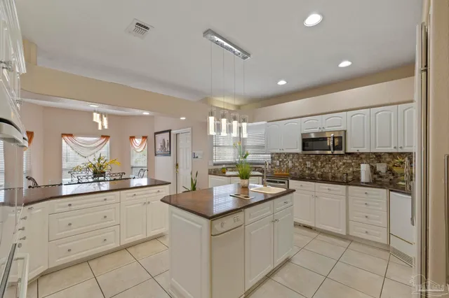 a white bath tub sitting next to a bathroom