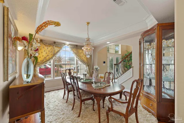 a bedroom with a large bed and furniture