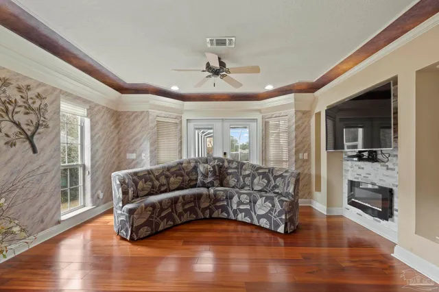 a bedroom with a bed and a television