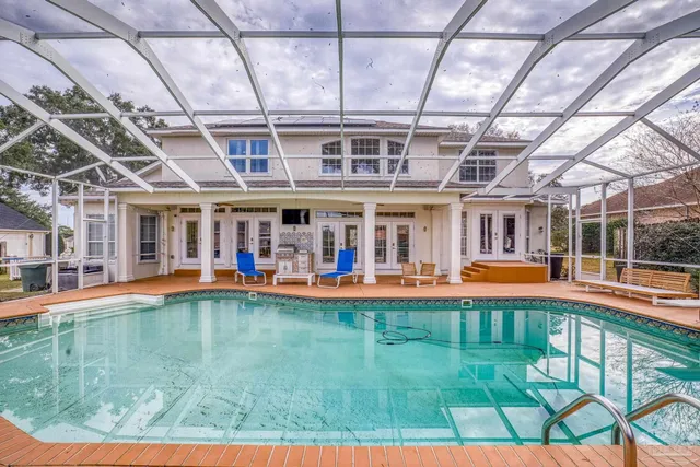 a view of a house with backyard porch and sitting area