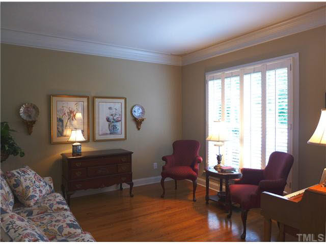 7209 Sparhawk Road Wake Forest, NC 27587 - Photo 3 of 25 To the right thru an arched doorway is the Living Rm/Study w/detailed ceiling molding & plantation shutters. Studio/Study/Office