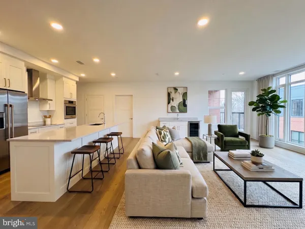 a kitchen with stainless steel appliances a refrigerator and a stove