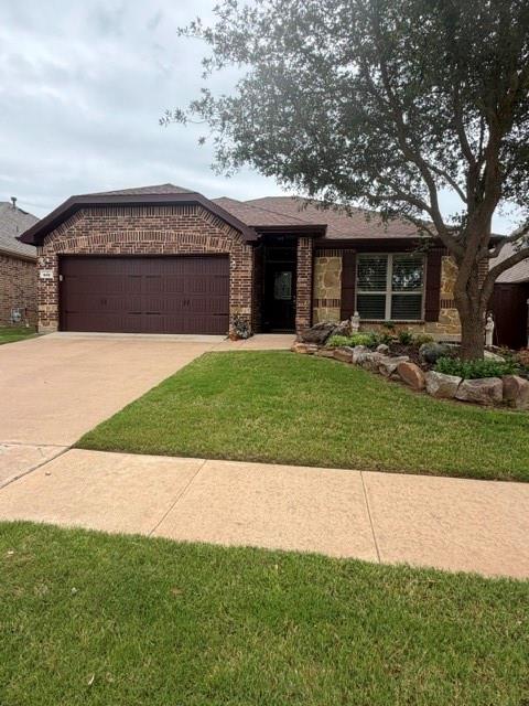 202 Tower Circle Terrell, TX 75160 - Photo 1 of 39 a front view of a house with a garden and trees