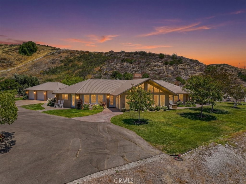 31233 Romero Canyon Road Castaic, CA 91384 - Photo 36 of 38 a view of a big house with a big yard and large trees