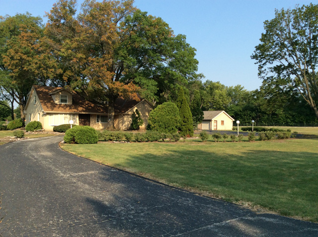 8S220 College Road Naperville, IL 60540 - Photo 2 of 20 a view of a house with a yard and a street