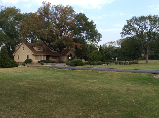 8S220 College Road Naperville, IL 60540 - Photo 19 of 20 a front view of a house with garden