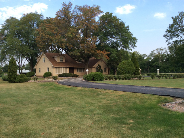8S220 College Road Naperville, IL 60540 - Photo 3 of 20 a view of a house with a yard and tree s