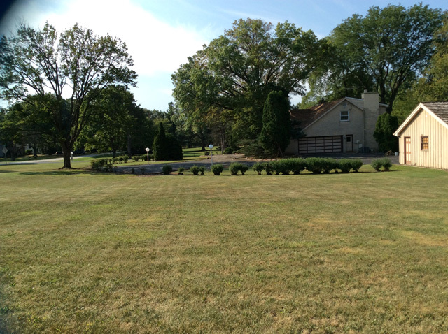 8S220 College Road Naperville, IL 60540 - Photo 8 of 20 a front view of a house with a yard