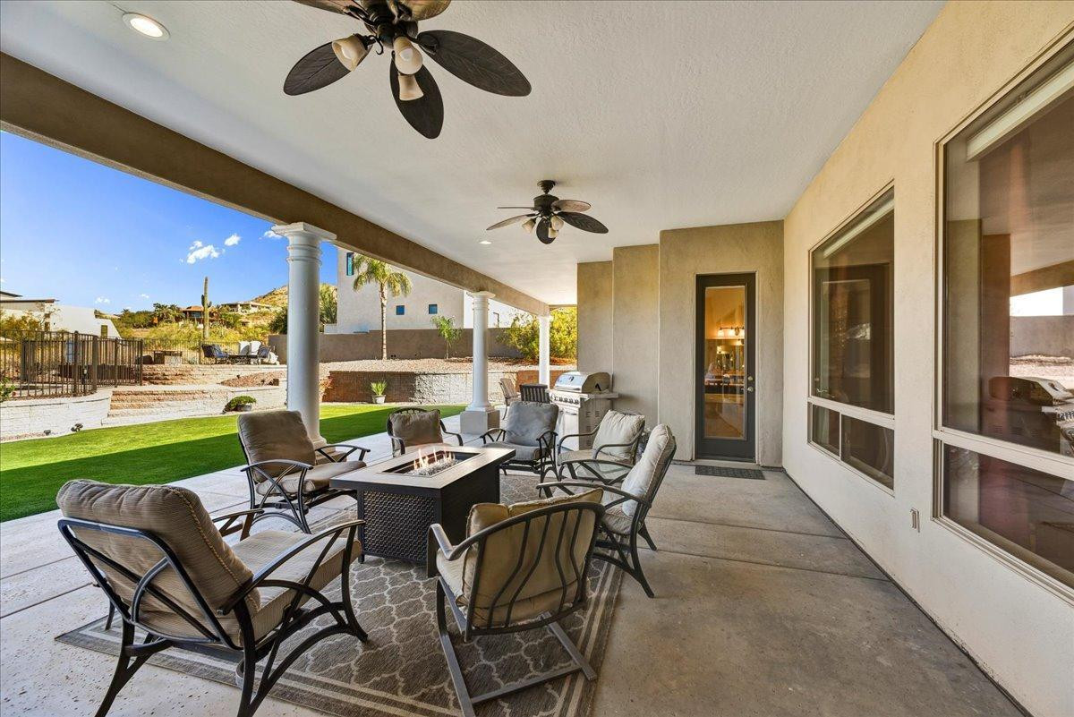 412 East Yearling Road Phoenix, AZ 85085 - Photo 32 of 51 a view of a patio with a table and chairs