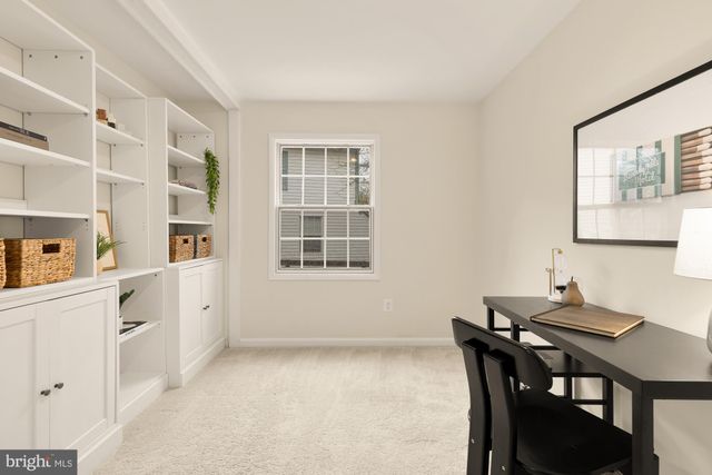 a bedroom with bed and window