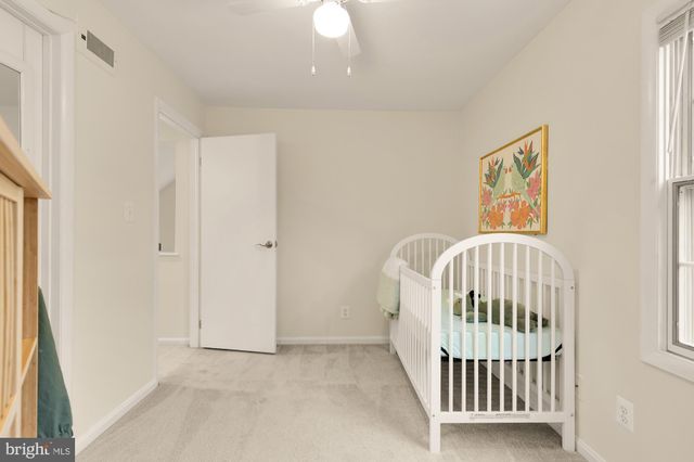 a view of a roof deck with table and chairs and wooden floor