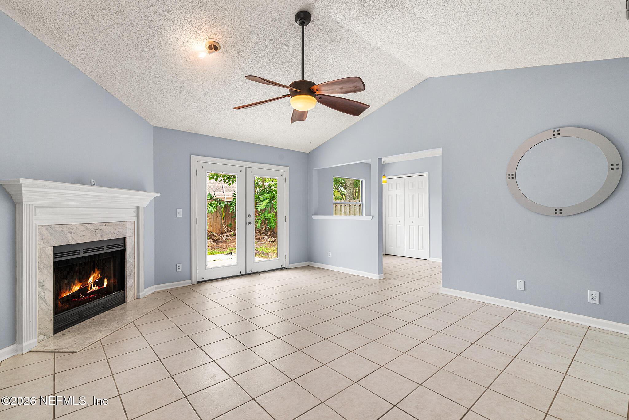 2020 Merced Court Jacksonville, FL 32224 - Photo 12 of 29 a view of an empty room with window and fireplace