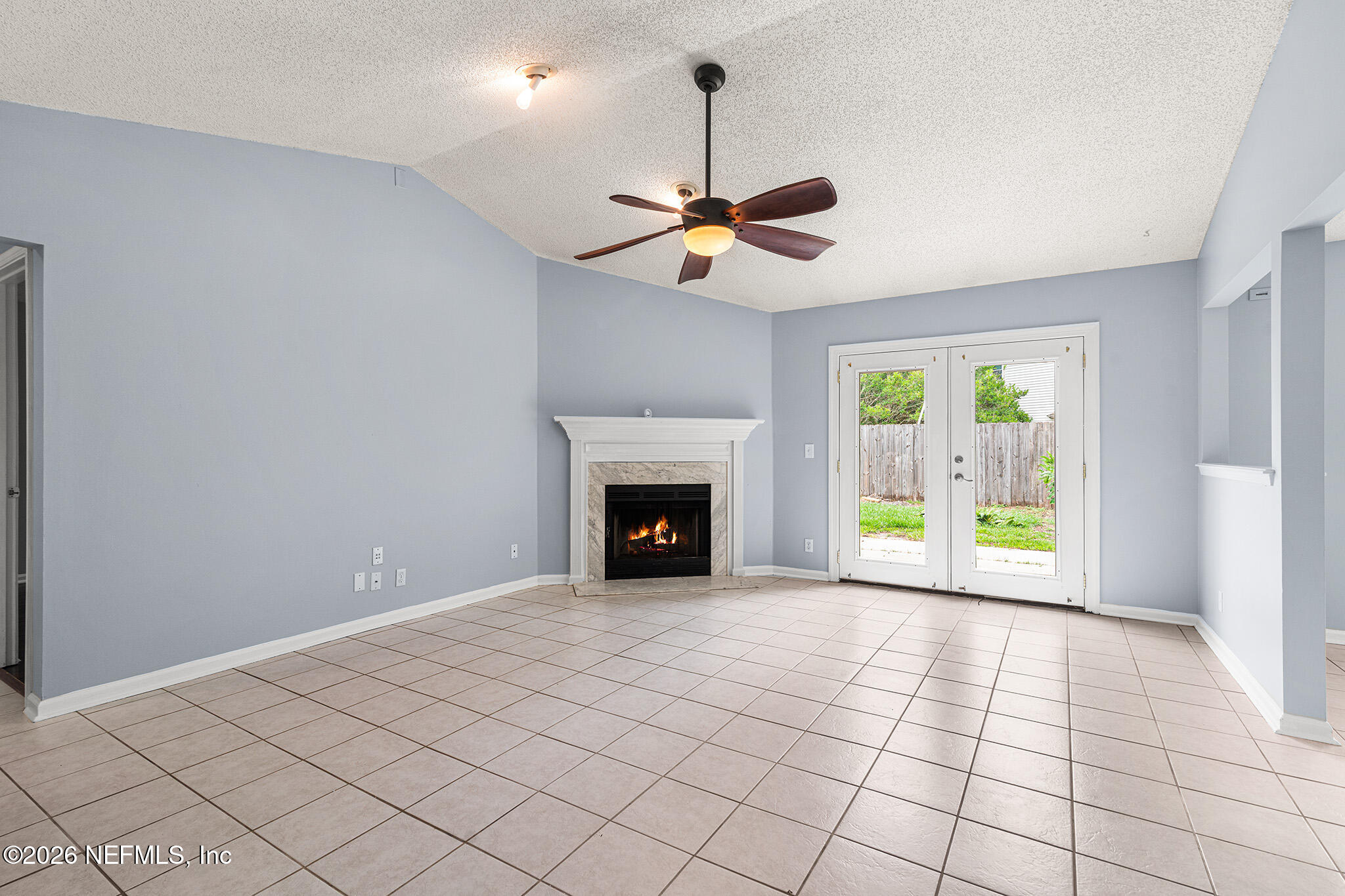 2020 Merced Court Jacksonville, FL 32224 - Photo 13 of 29 a view of an empty room with a fireplace and a window