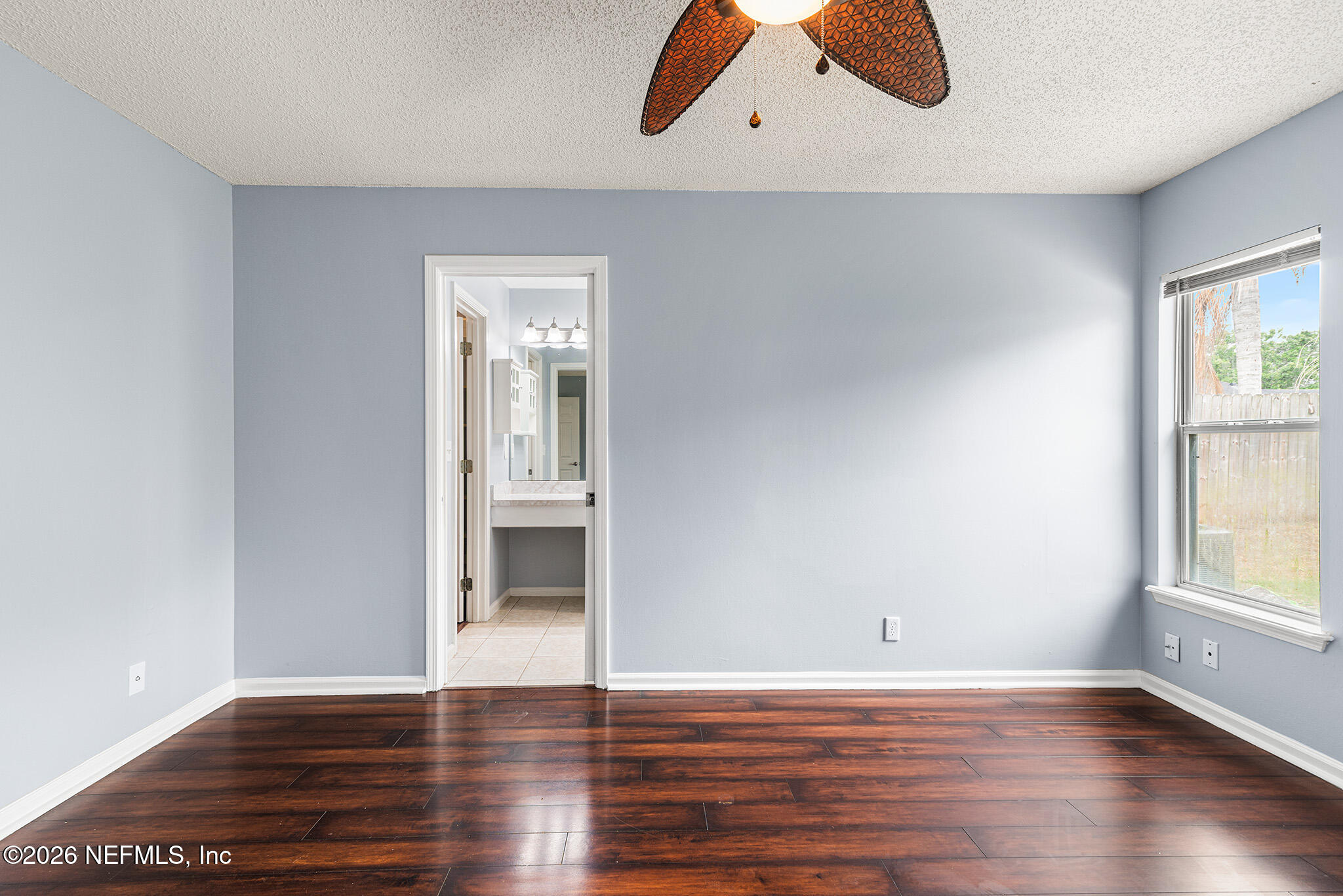 2020 Merced Court Jacksonville, FL 32224 - Photo 16 of 29 wooden floor in an empty room with a window
