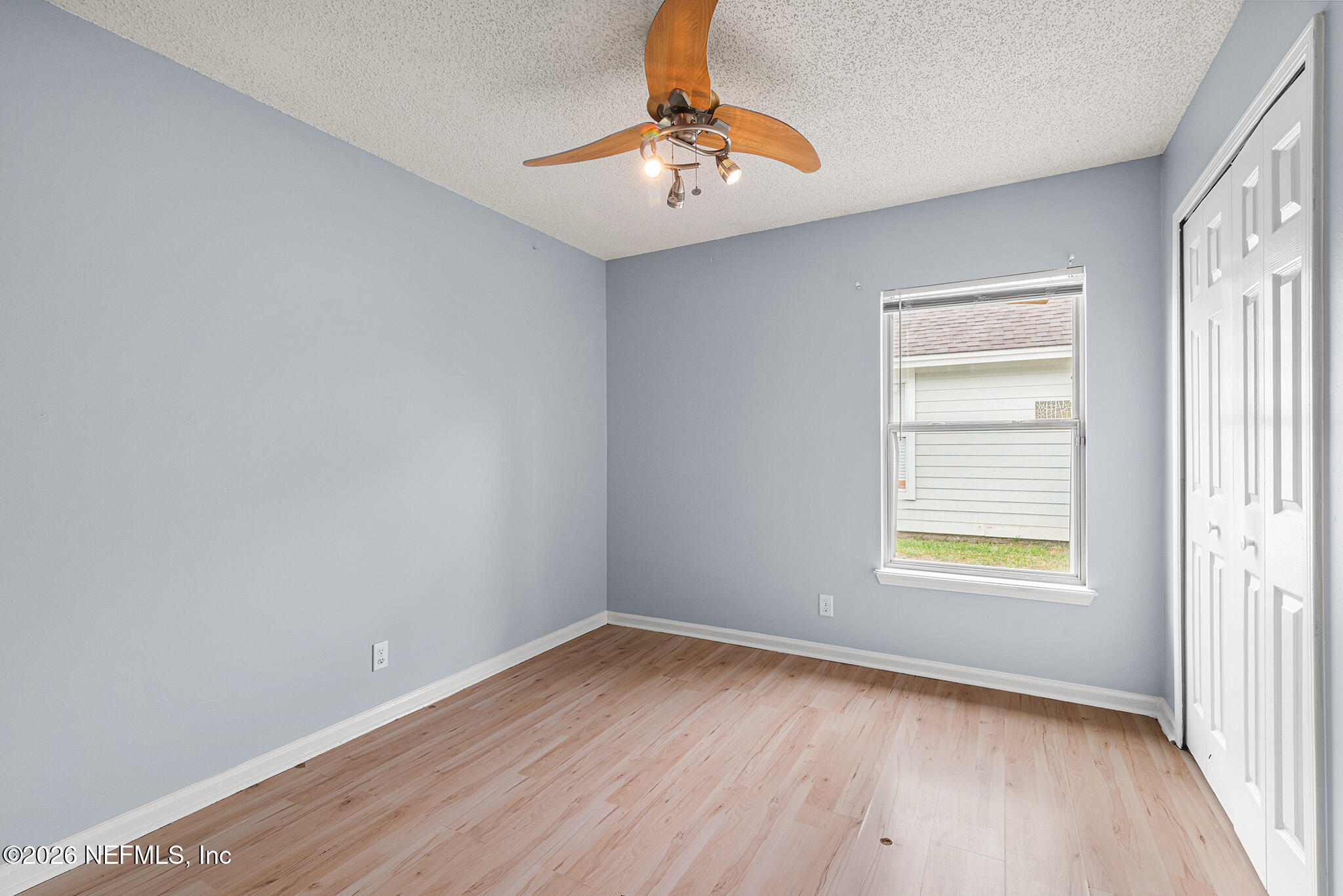 2020 Merced Court Jacksonville, FL 32224 - Photo 22 of 29 wooden floor in an empty room with a window