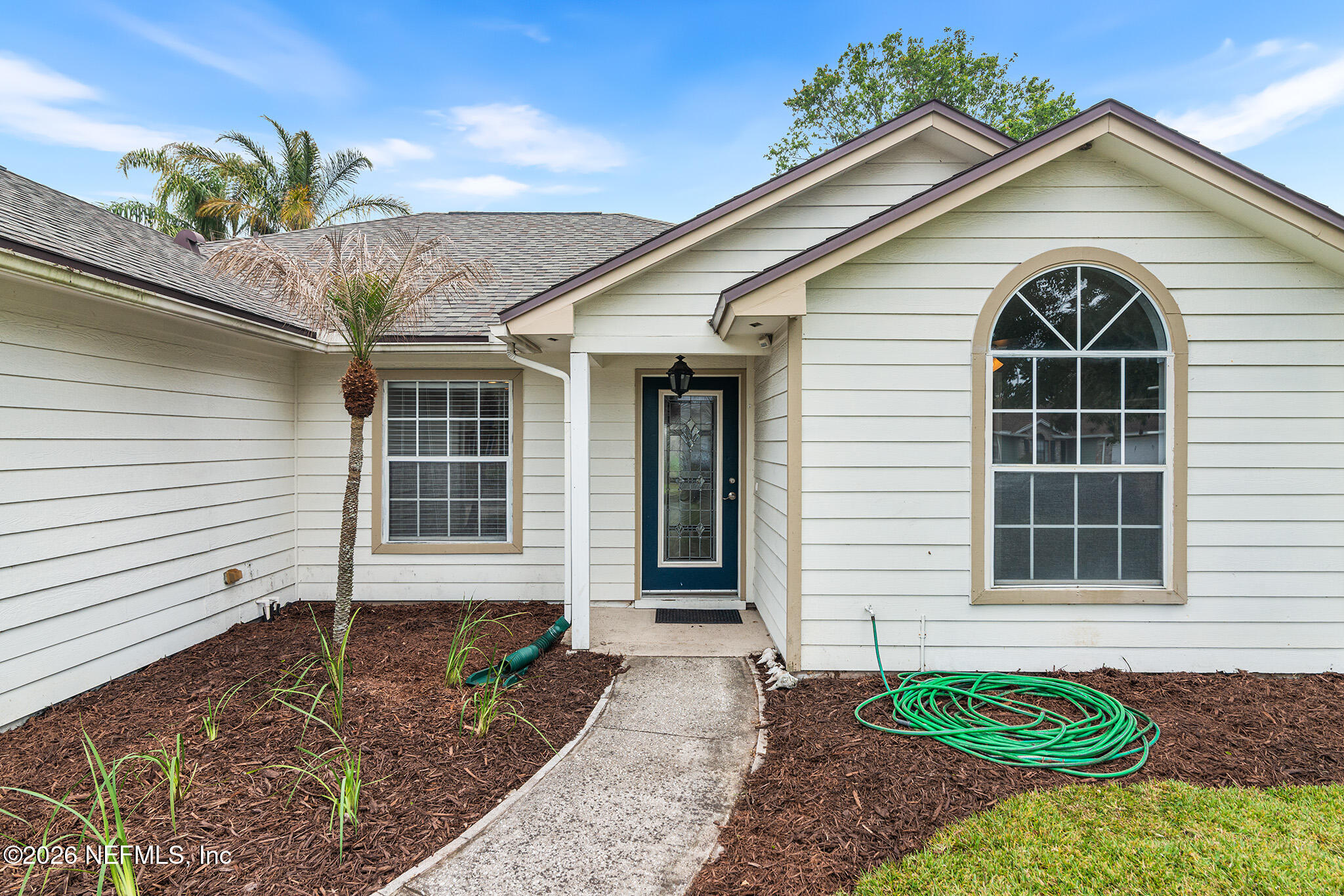 2020 Merced Court Jacksonville, FL 32224 - Photo 25 of 29 a view of small white house with a small yard