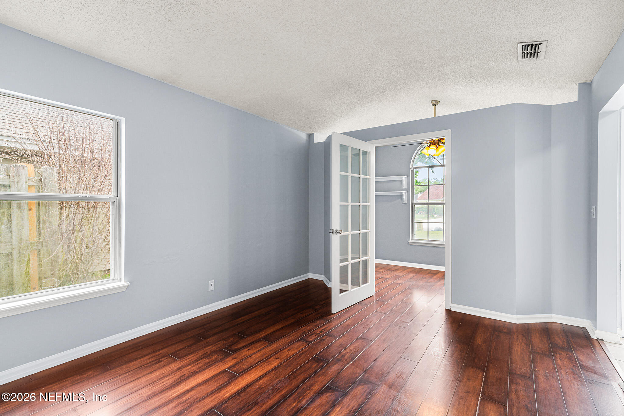 2020 Merced Court Jacksonville, FL 32224 - Photo 4 of 29 an empty room with wooden floor and windows