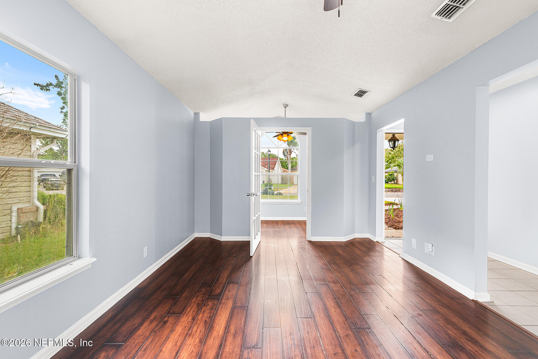 2020 Merced Court Jacksonville, FL 32224 - Photo 5 of 29 a view of an empty room with window and wooden floor