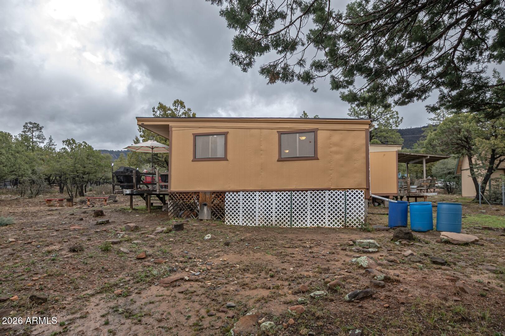 4120 North Whispering Pine Road Pine, AZ 85544 - Photo 16 of 30 a view of a house with a yard