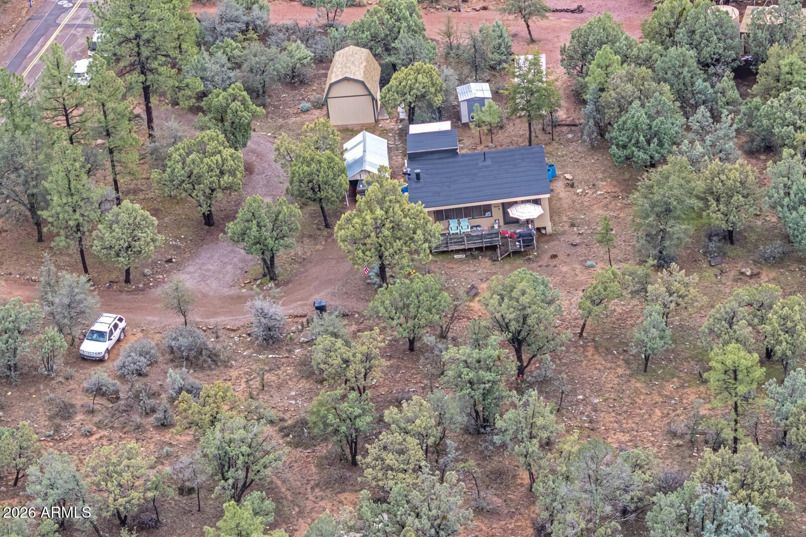 4120 North Whispering Pine Road Pine, AZ 85544 - Photo 27 of 30 a view of a house with a backyard