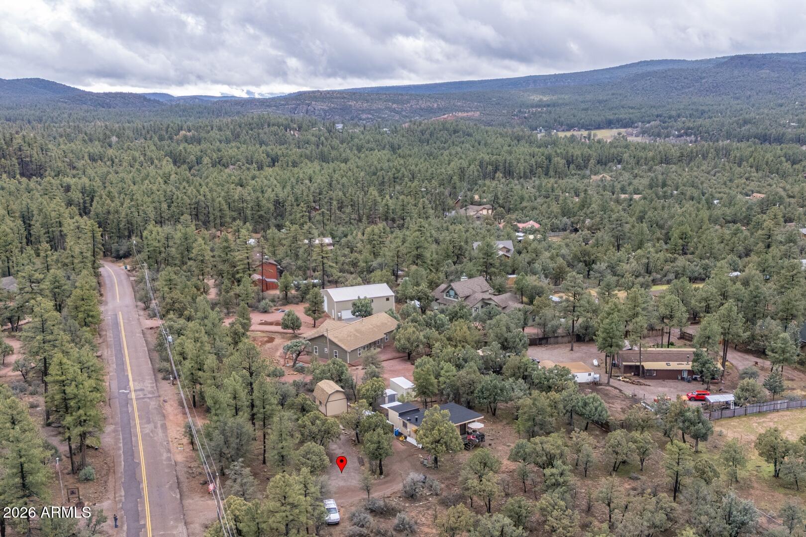 4120 North Whispering Pine Road Pine, AZ 85544 - Photo 28 of 30 an aerial view of residential house with outdoor space and trees all around