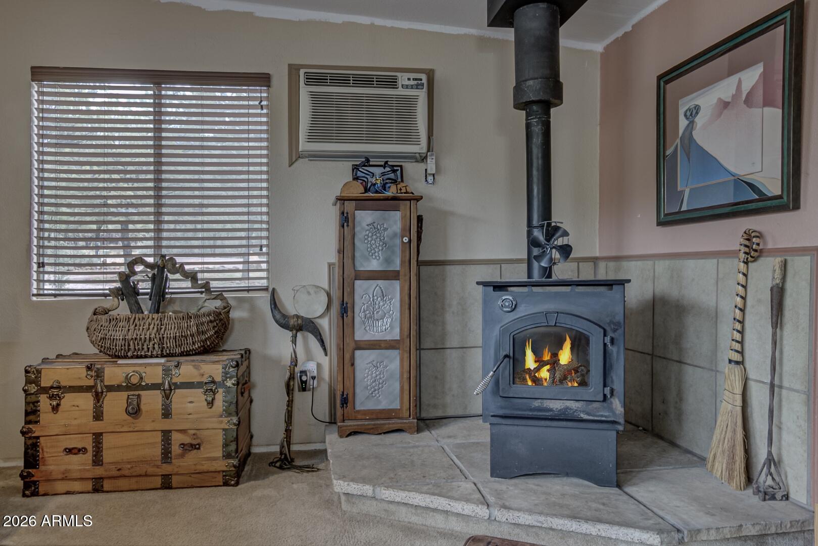 4120 North Whispering Pine Road Pine, AZ 85544 - Photo 3 of 30 a living room with furniture and a fireplace