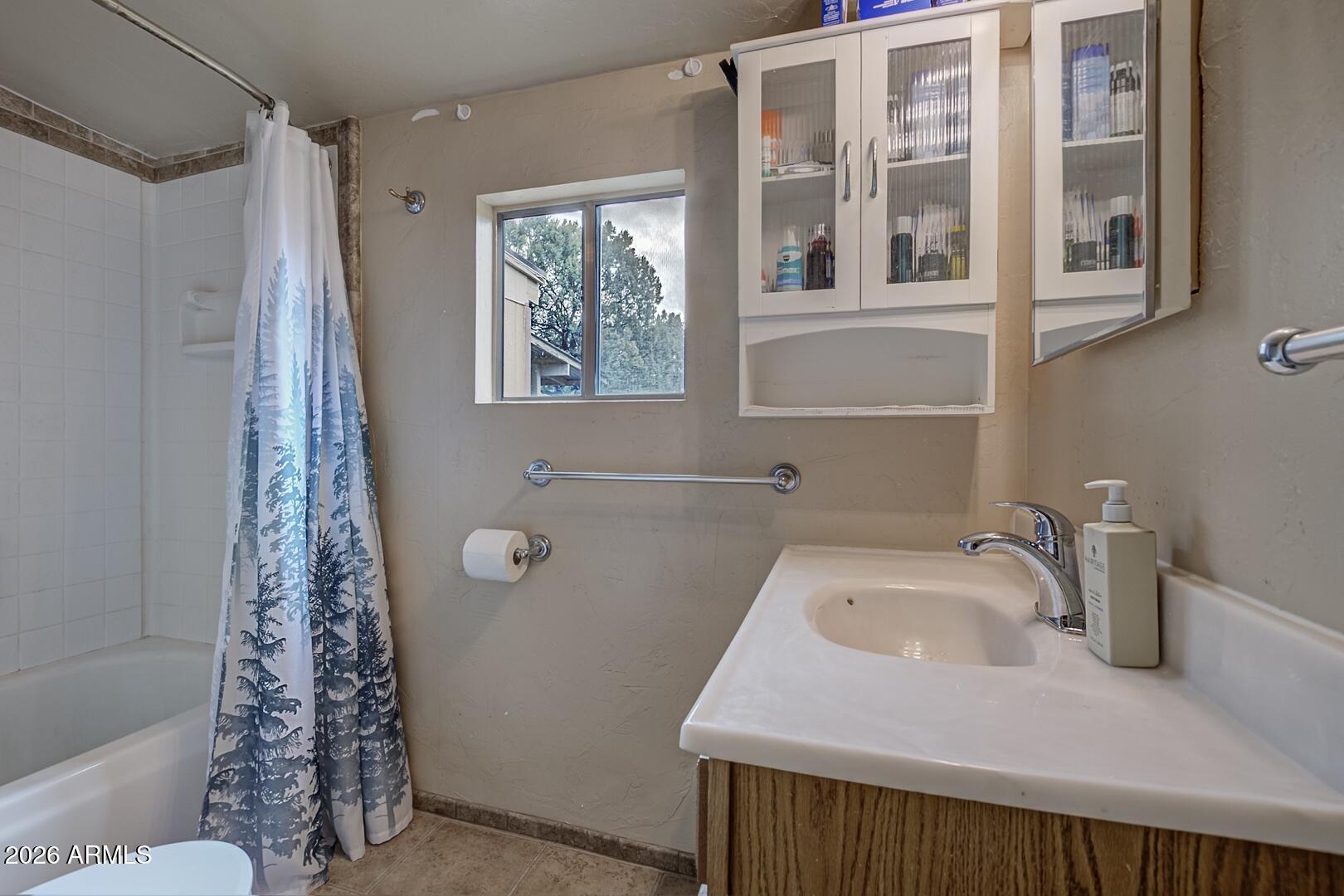 4120 North Whispering Pine Road Pine, AZ 85544 - Photo 8 of 30 a bathroom with a bathtub and shower
