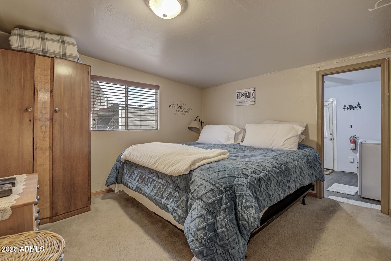 4120 North Whispering Pine Road Pine, AZ 85544 - Photo 10 of 30 a bedroom with a bed and window